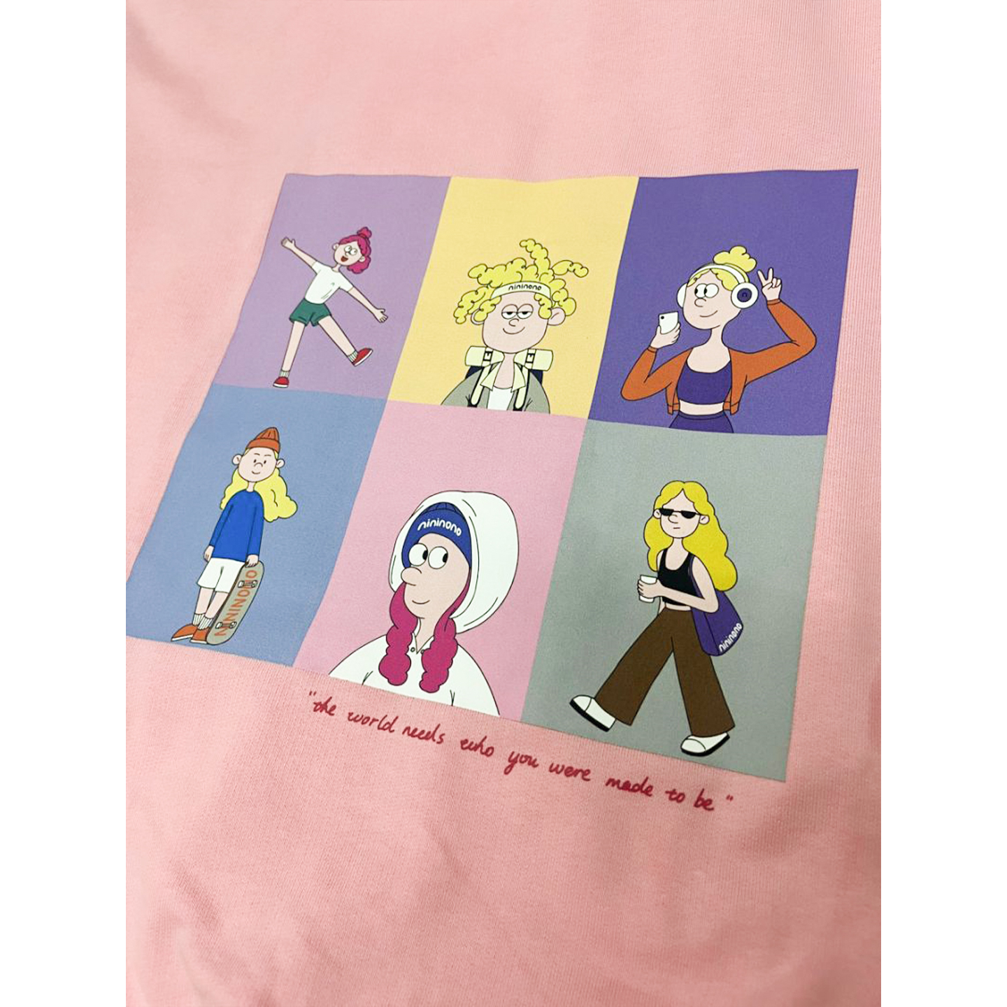 High-resolution close-up of the playful multi-character cartoon graphic printed on the back.