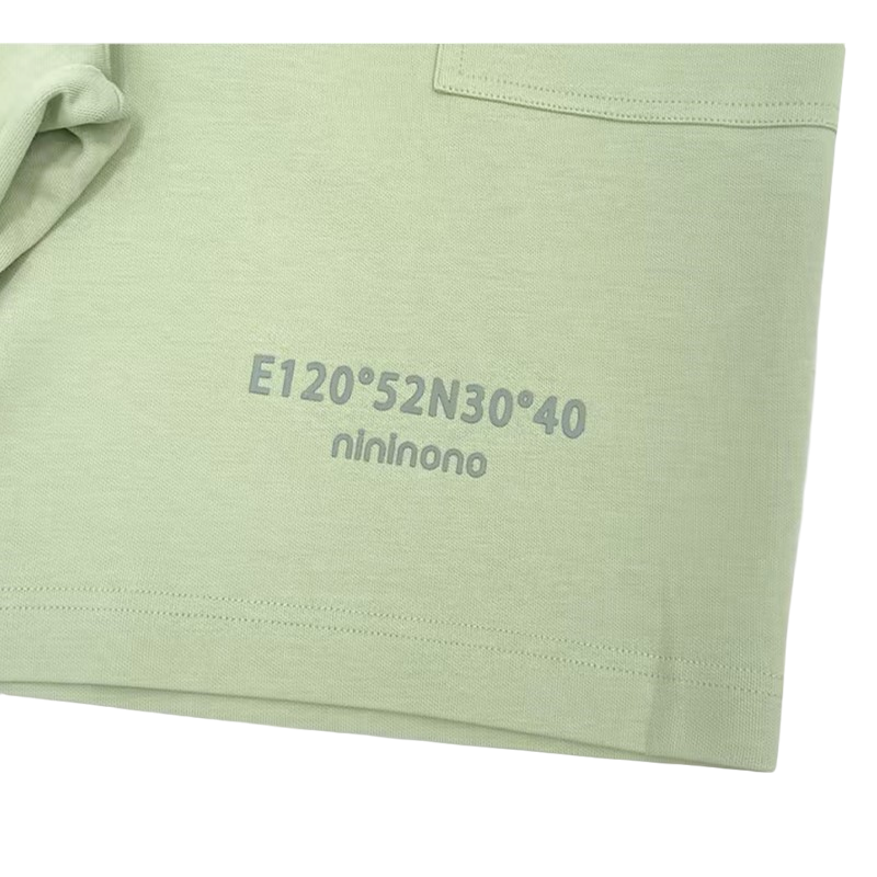 Detailed view of the coordinate graphic on the shorts, crafted with durable 3D silicone screen printing on heavyweight sage green cotton.