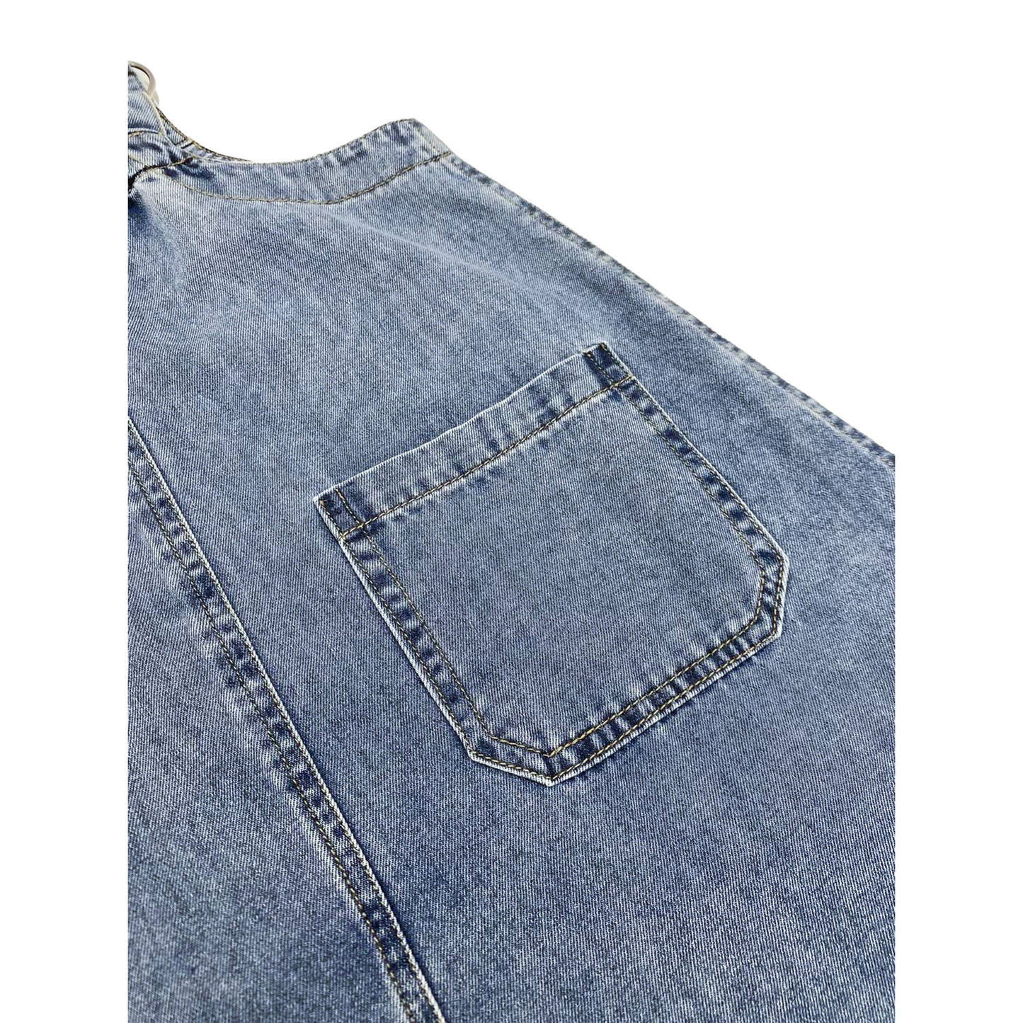Close-up of the functional back pocket on the denim pinafore dress, showcasing the clean double-needle reinforced stitching and the soft, authentic texture of the 100% cotton denim.