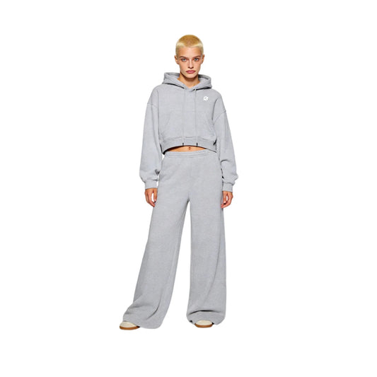 Full-body view of a female model in Ogender light gray cropped boxy hoodie and matching wide-leg