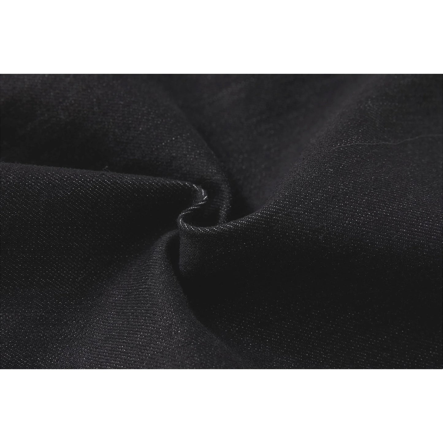 Macro shot of the premium 48% cotton and 20% modal-blend denim fabric texture.
