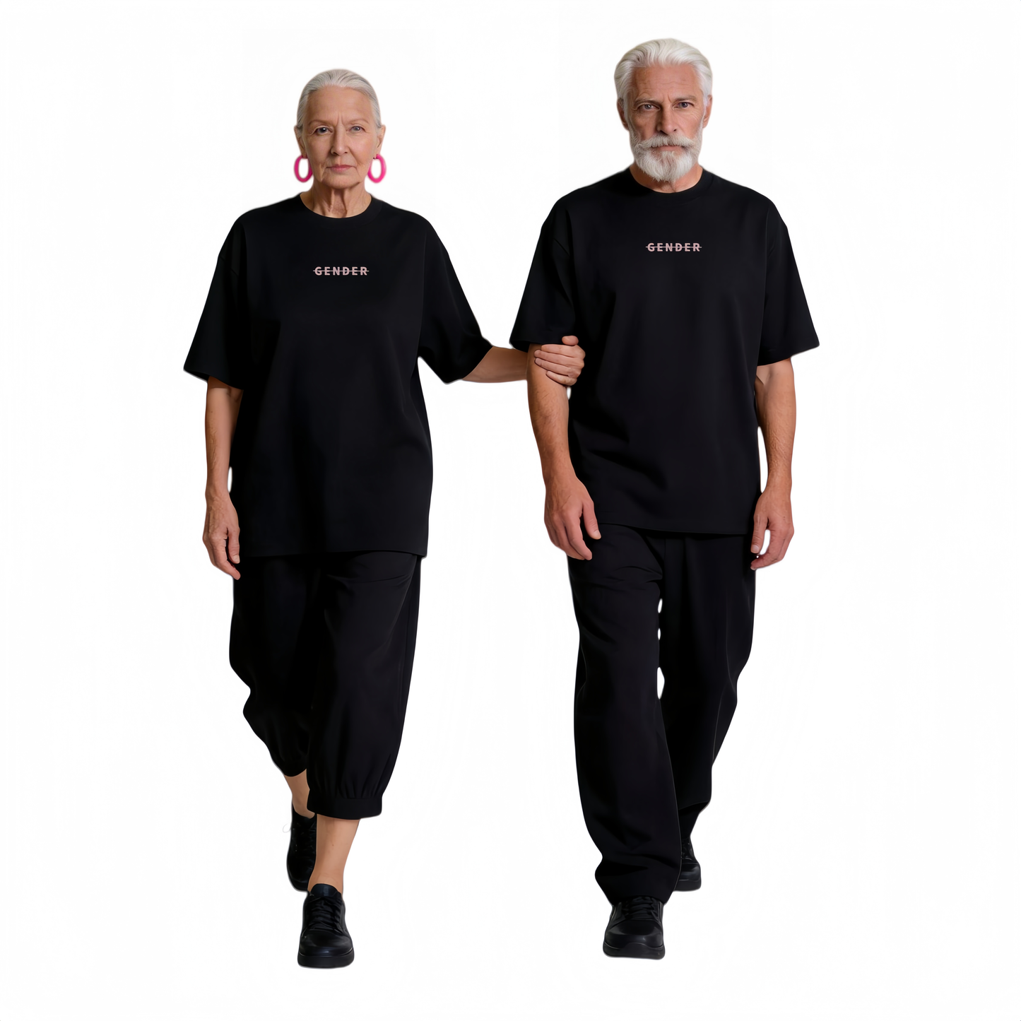 Stylish senior couple walking in coordinated Ogender black oversized tees and matching trousers, embodying the brand's ageless fashion philosophy.