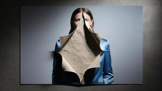 OGENDER's visual manifesto: A conceptual image of a perfect fashion ad ripping apart to expose the honest, tactile reality of fabric and its imperfections, highlighting the illusion of the fashion industry.