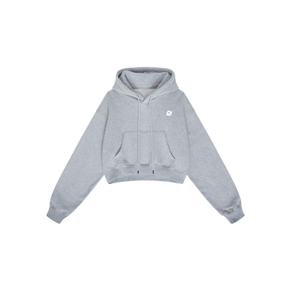 ØGENDER heather grey cropped fleece hoodie with "Ø" minimalist branding, featuring a relaxed boxy fit and 42% cotton blend.