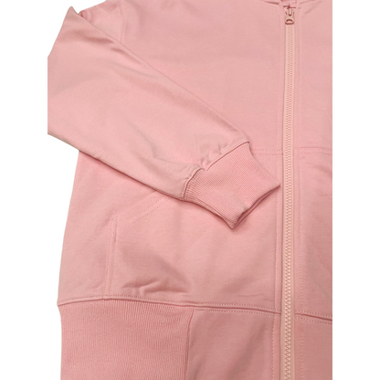 Detailed shot of the ribbed sleeve cuffs and smooth zipper closure on the pink sweatshirt.