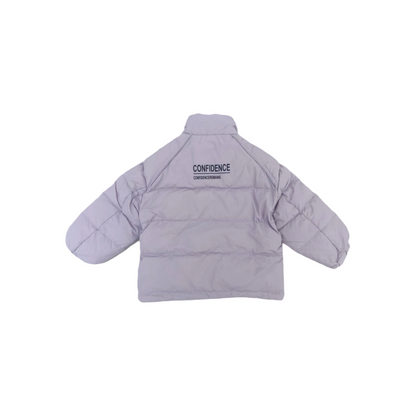 Back view of the ninø taro purple puffer jacket, highlighting the bold "CONFIDENCE" graphic print across the upper back and the clean horizontal quilting.