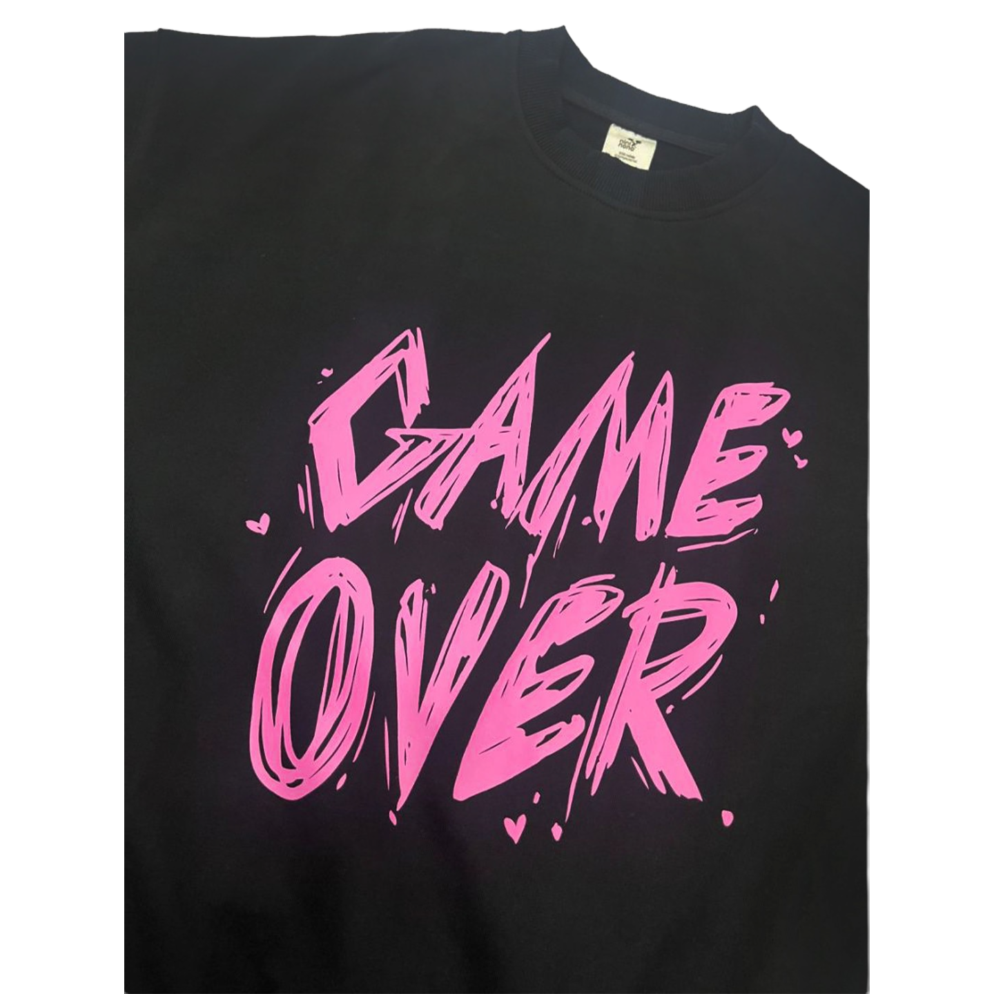 Close-up of the high-quality pink "GAME OVER" typography on the black cotton fabric.