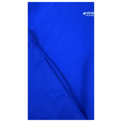 Detailed view of the side of the Klein blue sweatshirt, highlighting the functional and discreet side seam pocket for a clean, minimalist look.