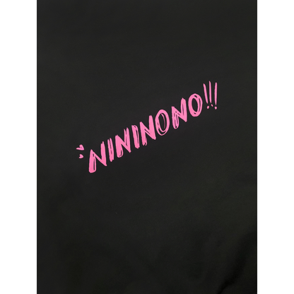 Close-up of the pink "NININONO!!!" branding printed on the upper back of the sweatshirt.