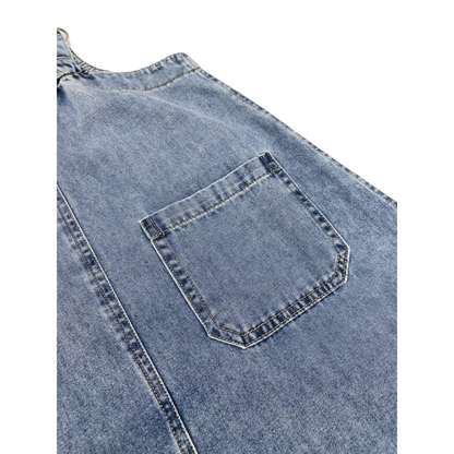 Close-up of the functional back pocket on the denim pinafore dress, showcasing the clean double-needle reinforced stitching and the soft, authentic texture of the 100% cotton denim.