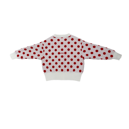 Back view of the polka dot cardigan showcasing the "nininono" brand embroidery across the shoulders.