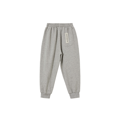 Back view of the Heather Grey joggers, featuring the signature Ogender sewn-on coordinate label on the pocket.