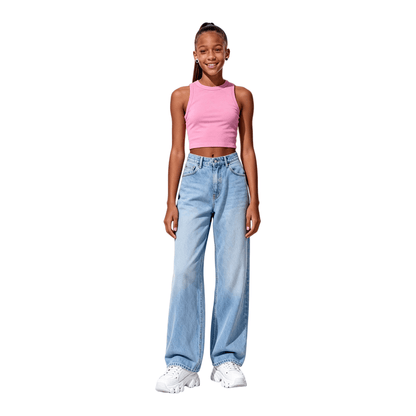 Teenage model wearing pink cropped tank top with wide-leg jeans, chic urban streetwear style.