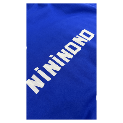 Close-up of the back of the Klein blue hoodie, showcasing the bold white "NININONO" text print with a modern, high-contrast aesthetic.
