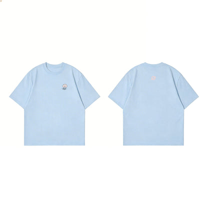 ØGENDER light blue oversized graphic tee with a pink jellyfish, soft summer pastel streetwear.