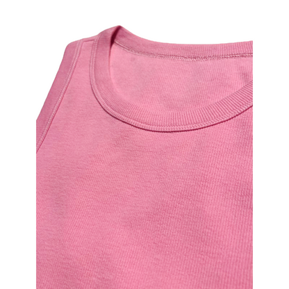 Detailed view of the ribbed round neckline and high-quality stitching on the pink tank top.