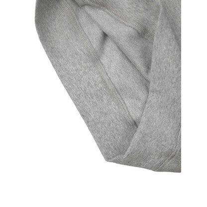 Close-up of the flipped hem on the kids' sweat vest, showing the clean interior finish and the soft, high-density French terry texture.