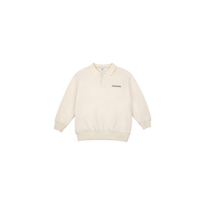 Front view of the khaki polo sweatshirt featuring the refined button collar and oversized silhouette.
