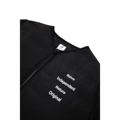 Close-up of the smooth black YKK zipper and the industrial-style text printed on the chest.