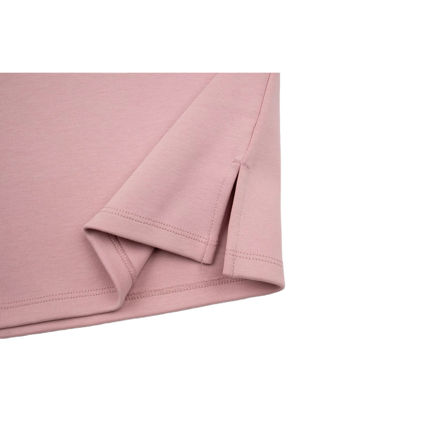 Detailed shot of the side slit at the hem of the pink dress, designed for improved movement and comfort.