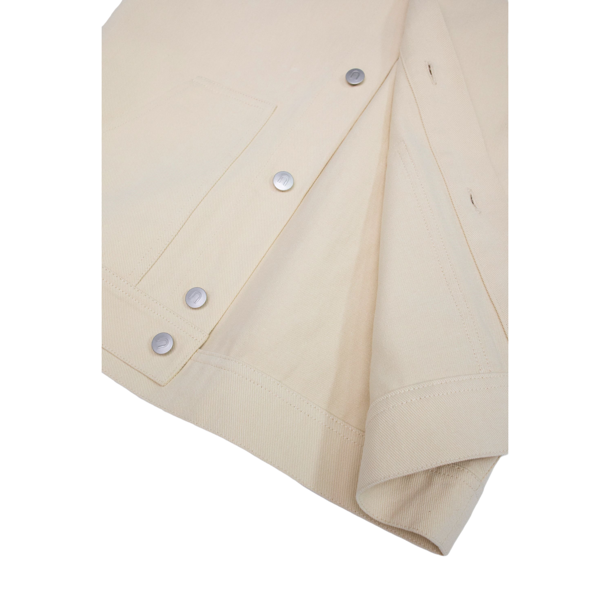 Close-up of the front hem of the khaki workwear jacket, showcasing the neat interior finishing and the durable 100% cotton denim fabric texture.