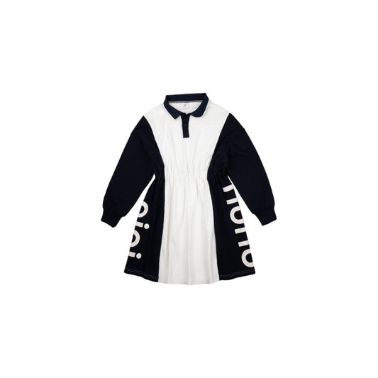 Front view of the ninø kids' color-blocking polo dress, featuring a dark navy and white design with an elastic waist and side logo graphics.