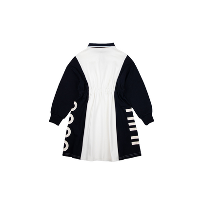 Back flat lay of the preppy polo dress, highlighting the clean navy and white paneling and the elasticated waistband for a comfortable fit.