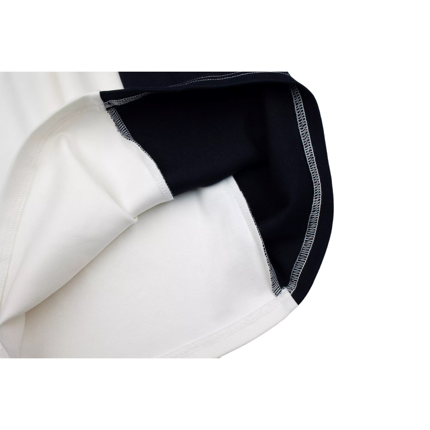 View of the dress hem turned inside out, showcasing the soft interior texture and professional overlock stitching of the heavy 340g/m² cotton blend.