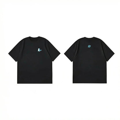 ØGENDER black oversized unisex tee with a minimalist blue dolphin graphic on the chest, 100% cotton.