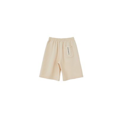 Back flat lay of the Light Khaki shorts, showing the relaxed gender-neutral silhouette and secure back pocket.