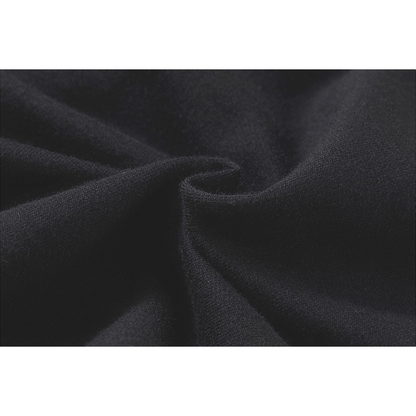 Extreme close-up of the 100% premium cotton fabric in jet black, highlighting the soft, high-density French terry knit and breathable texture.