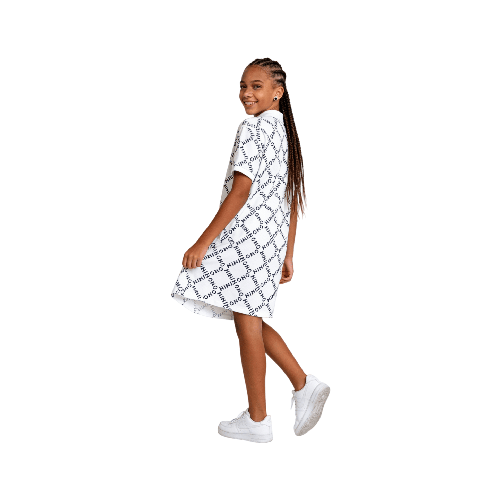 Back view of a girl wearing the white and black logo print polo dress, highlighting the clean finish and breathable fabric texture.
