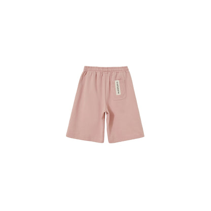 Back view of Pink kids sweat shorts featuring the industrial woven label.