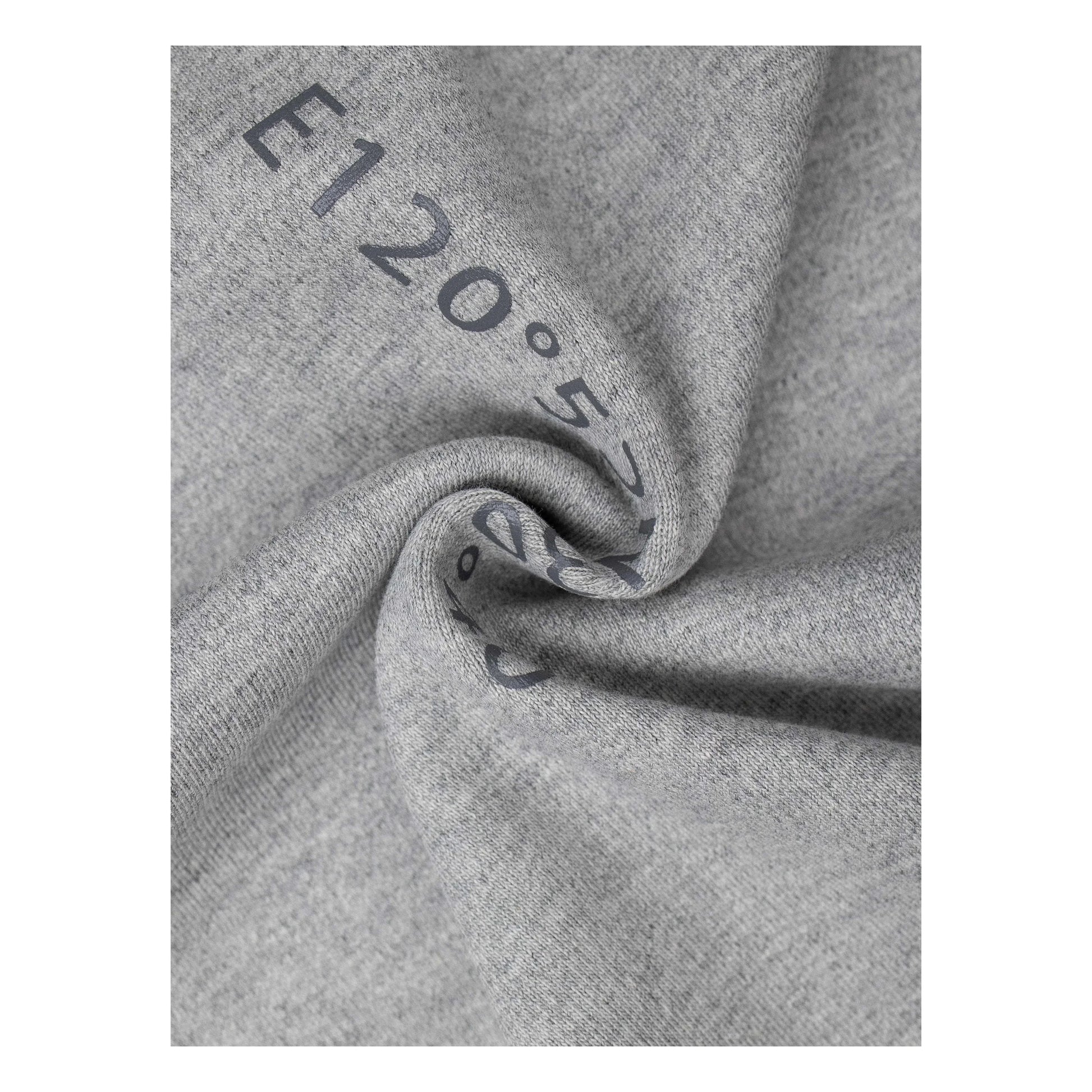 Macro shot of the premium 340 GSM cotton-elastane fabric, highlighting its structured feel