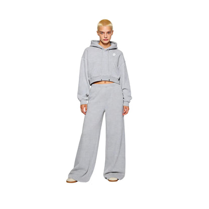 Full-body view of a female model in Ogender light gray cropped boxy hoodie and matching wide-leg