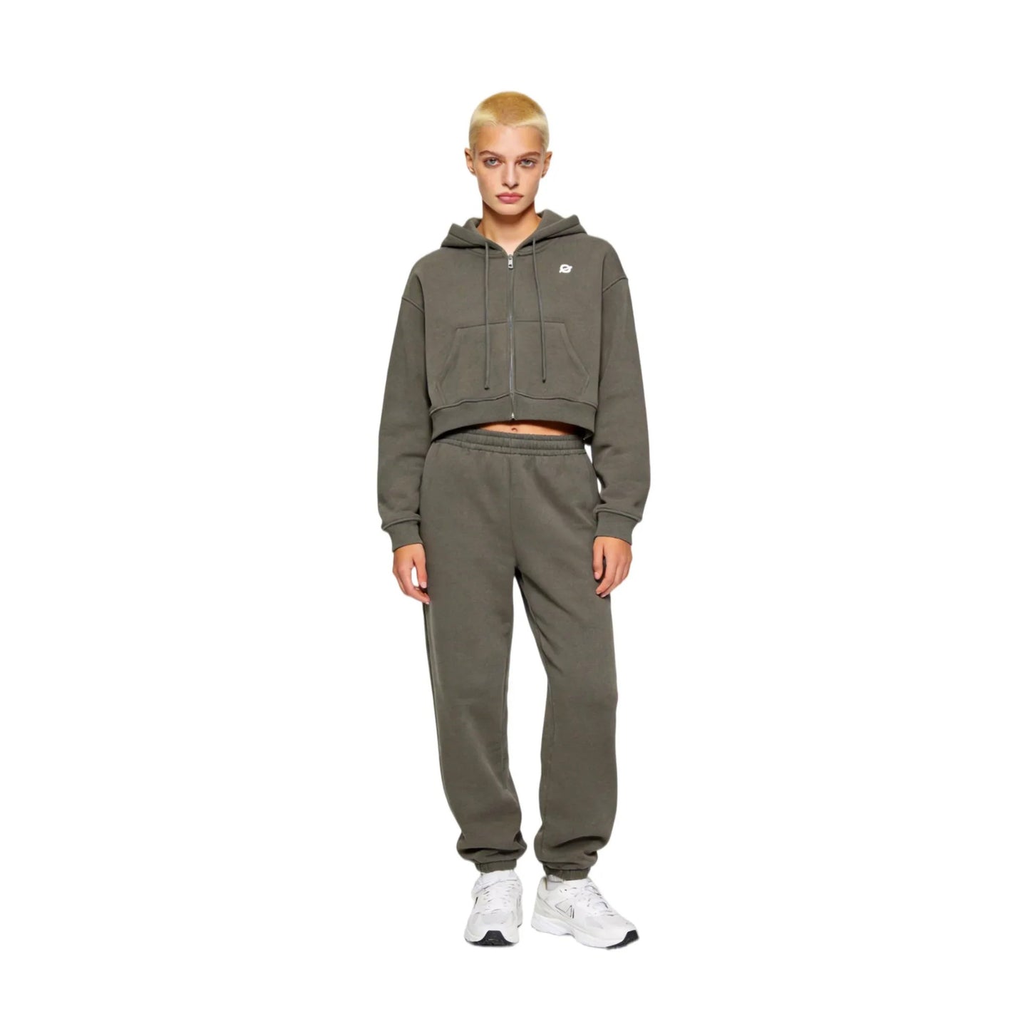 Full-body front view of a female model wearing Ogender dark gray cropped zip-up hoodie and matching joggers, showcasing a relaxed streetwear set