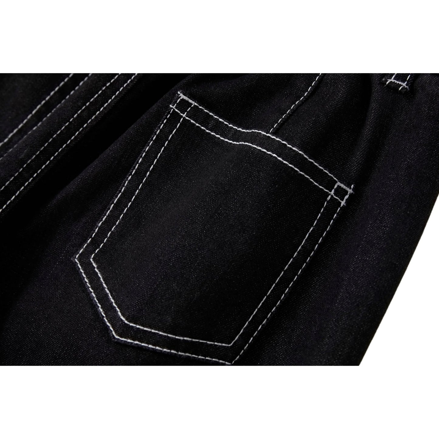 Close-up of the signature rear patch pocket on Ogender modal-blend denim.