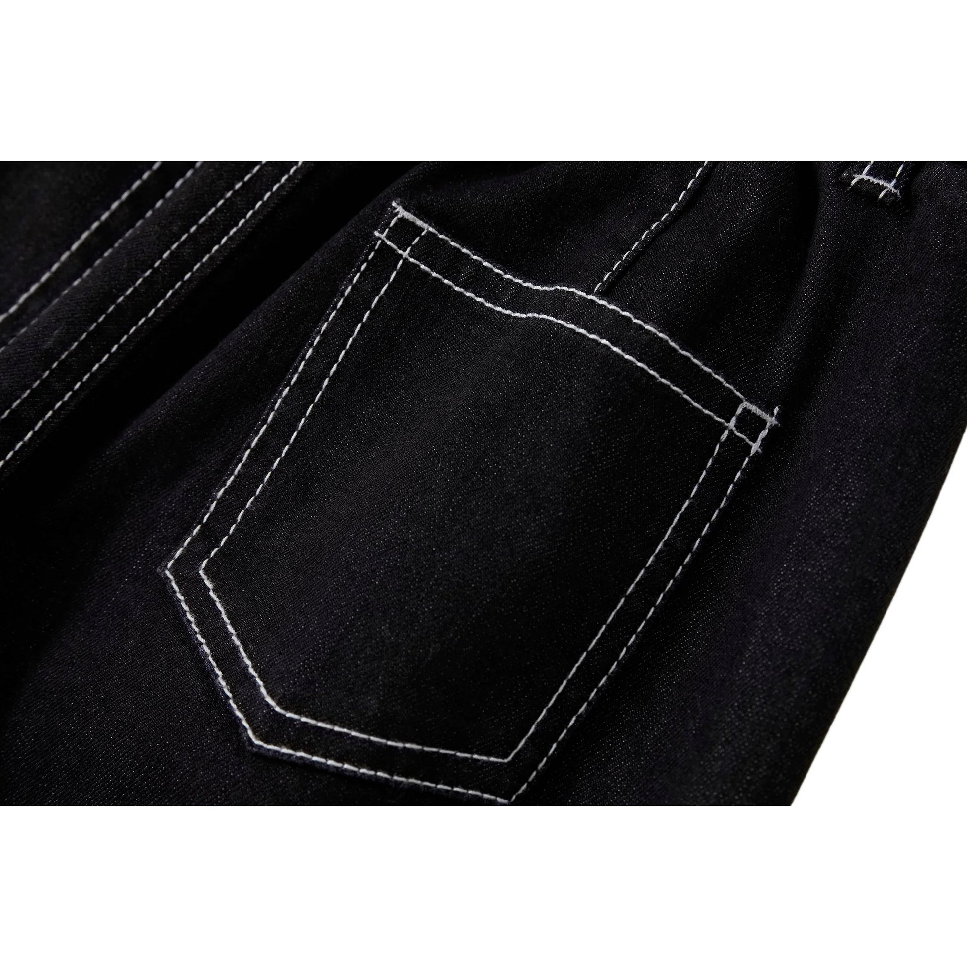 Close-up of the signature rear patch pocket on Ogender modal-blend denim.