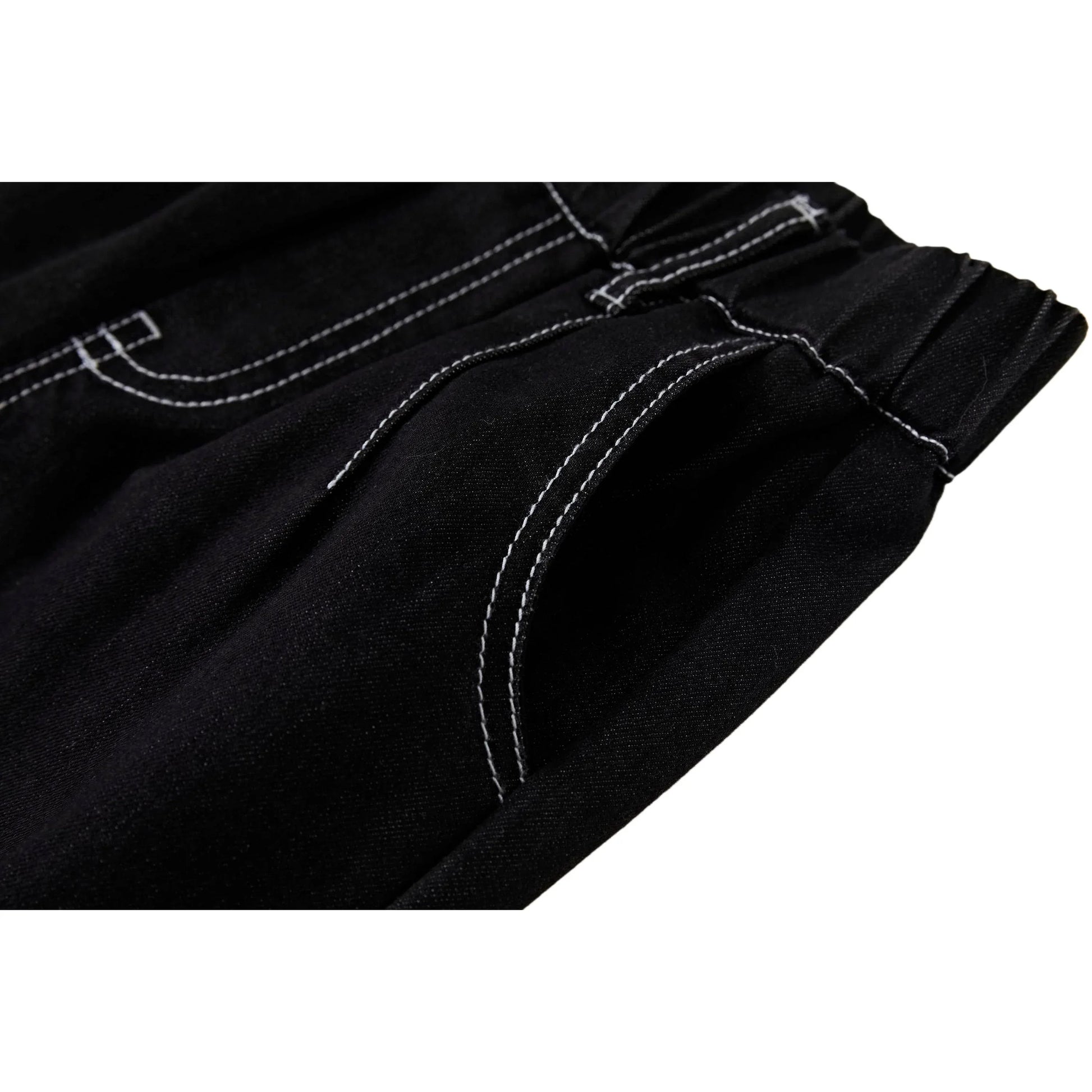 Detailed shot of the functional front slant pocket with modern white stitch detailing.