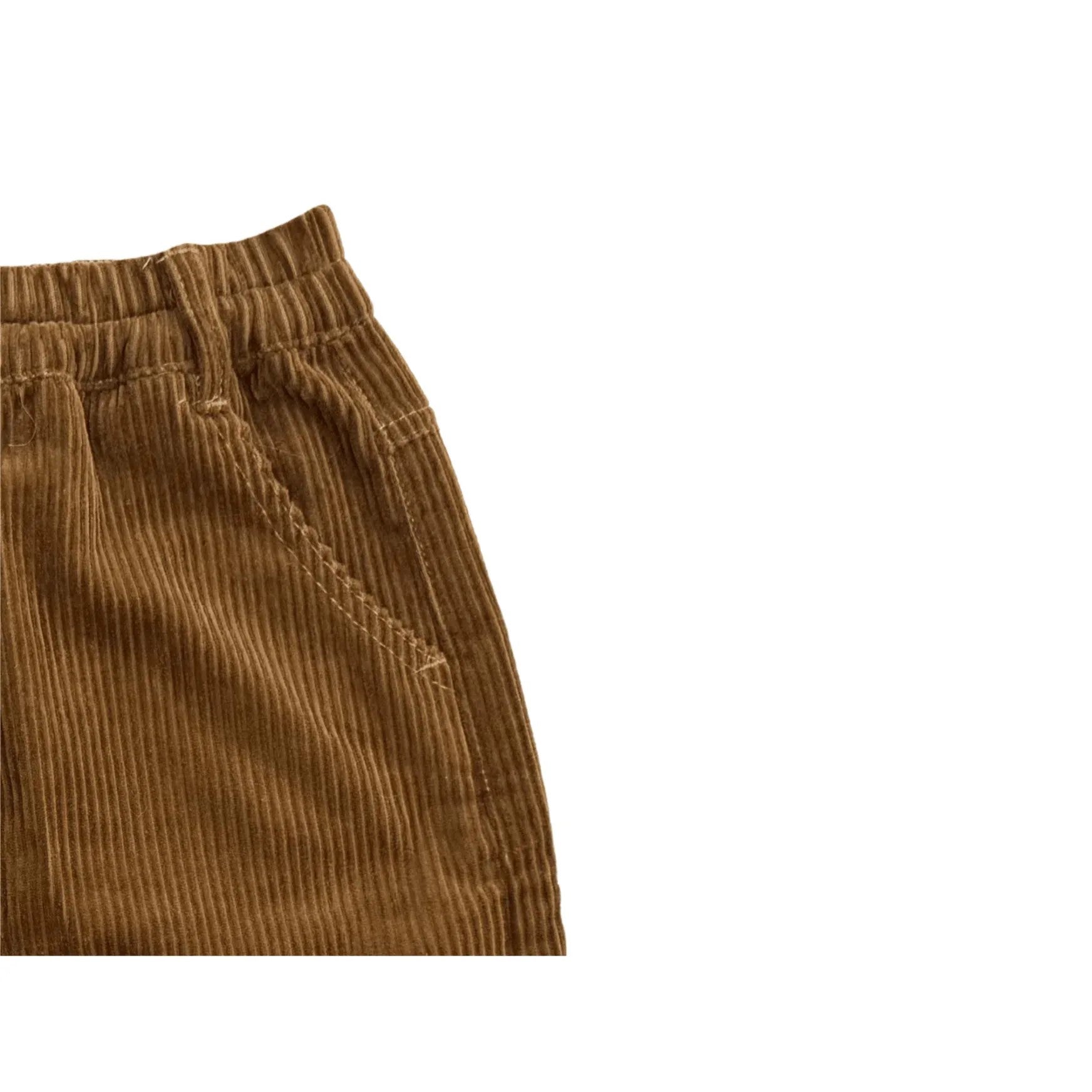 Detailed shot of the comfortable elastic waistband and side pocket of the skirt.