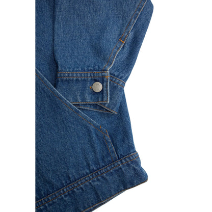 Detailed shot of the sleeve cuff with branded metal button and utility pocket stitching.