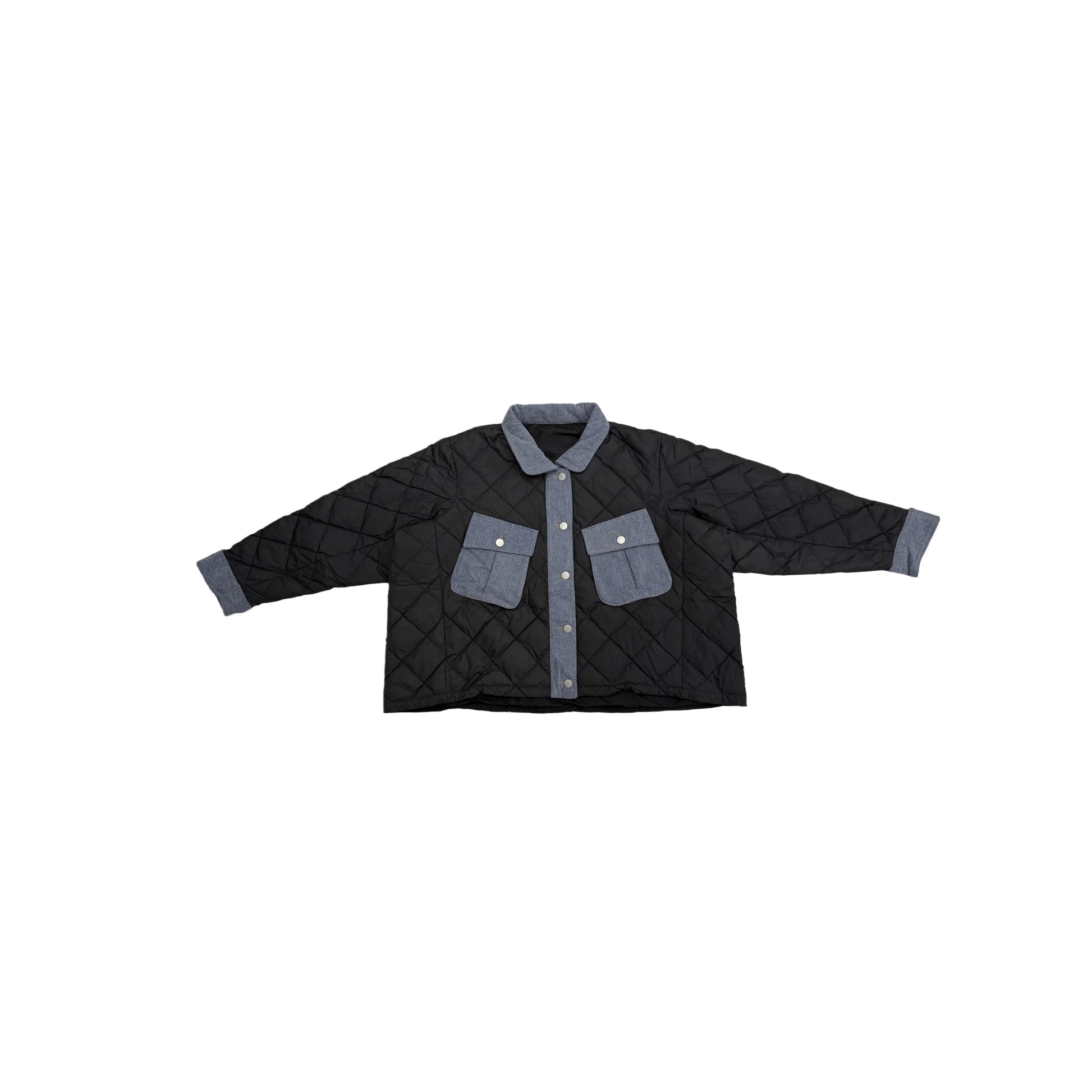 Front view flat lay of the oversized black diamond-quilted puffer jacket with denim pockets.