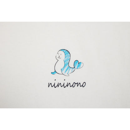 High-definition detail of the blue dolphin graphic and handwritten "nininono" text.
