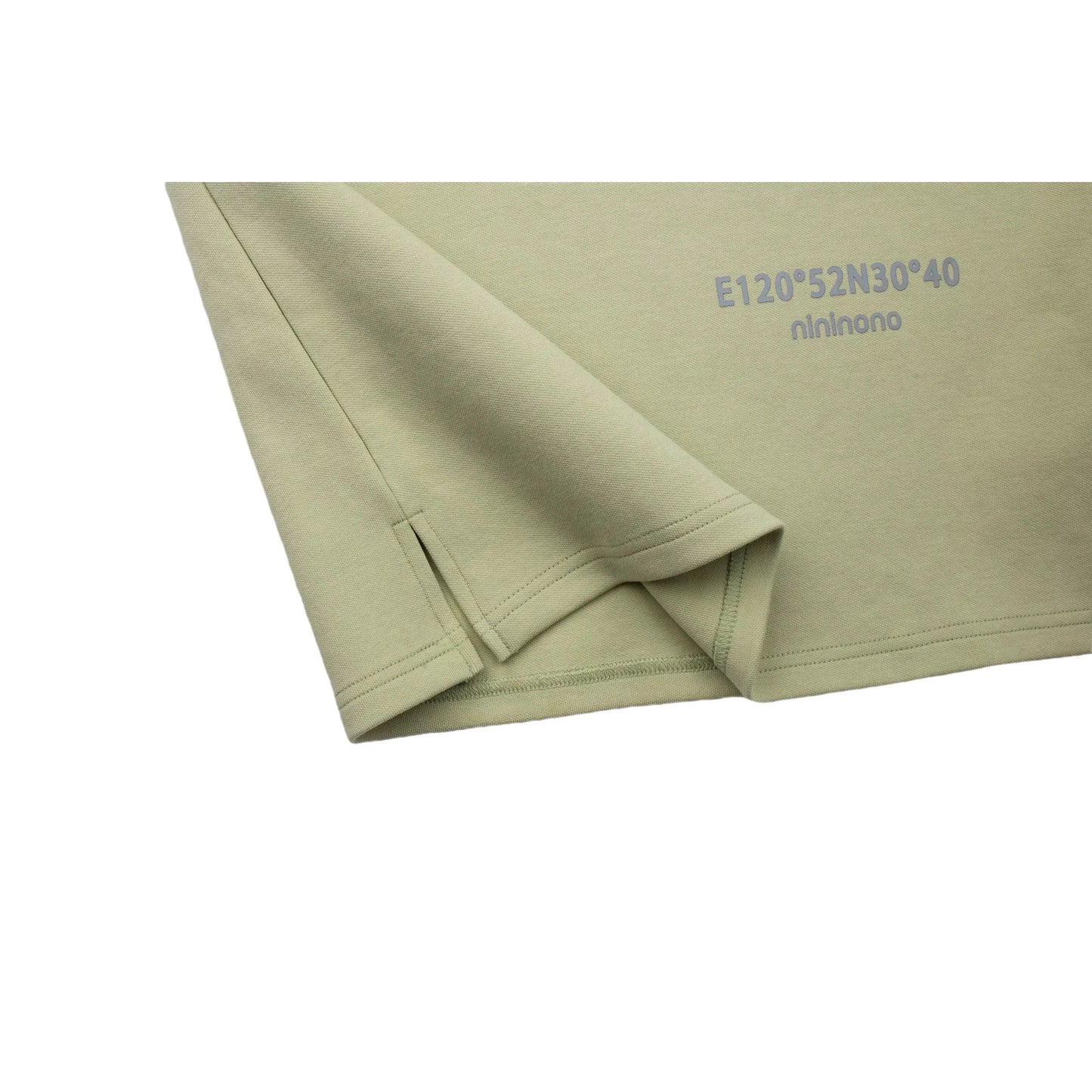 Detailed view of the reinforced side slit on the avocado green dress.