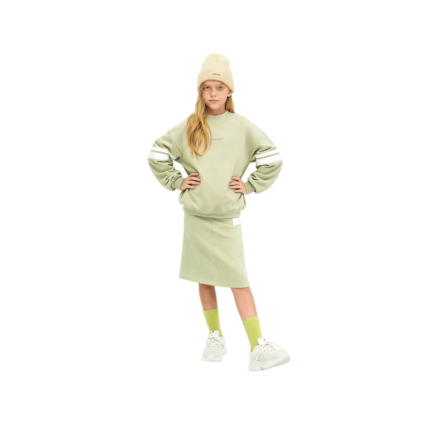 A girl modeling the avocado green sweatshirt and matching A-line skirt set.