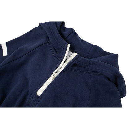 Close-up of the white contrast half-zip and the soft hood construction.