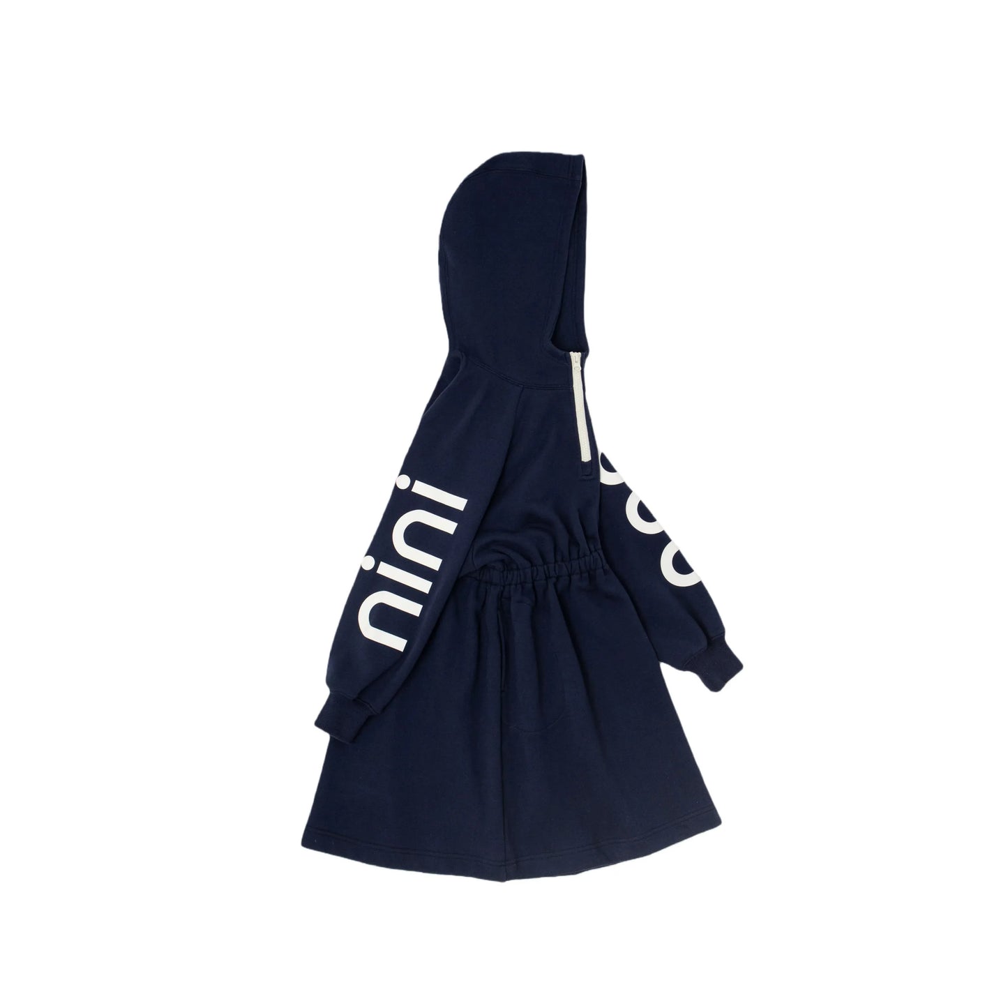 Side view showing the bold white "nini" print on the sleeve of the navy dress.