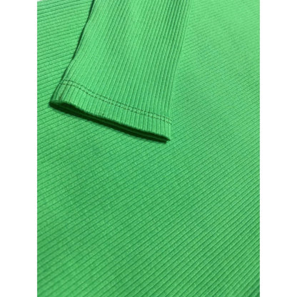 Detail of the neatly stitched sleeve cuff and the heavyweight 290 GSM green cotton fabric.