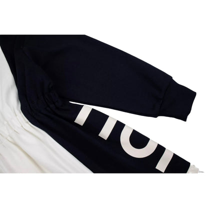Detailed shot of the 340 GSM fabric and the rubberized branding near the cuff.