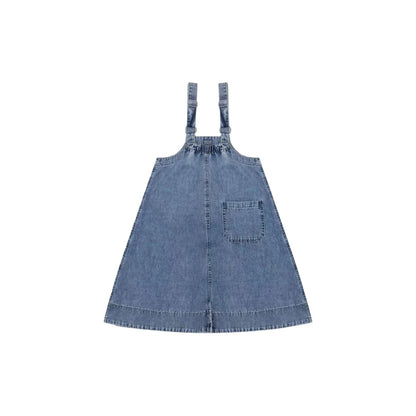 Back view of the denim overall dress showing the single right-side pocket and adjustable straps.